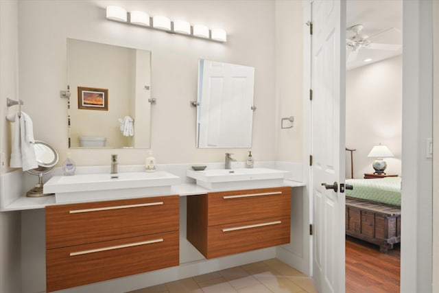 bathroom featuring ceiling fan, vanity, and toilet