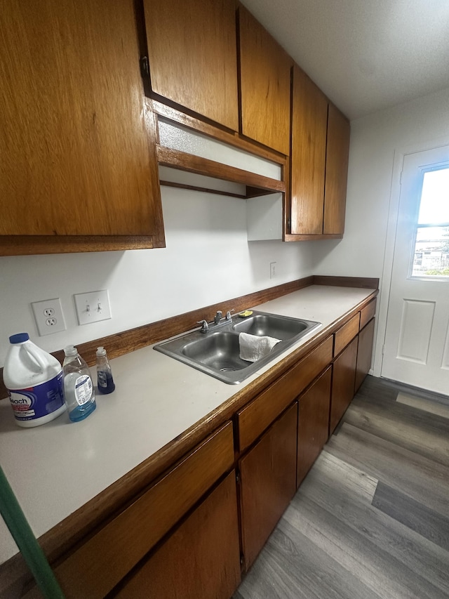 kitchen featuring sink and light wood-type flooring