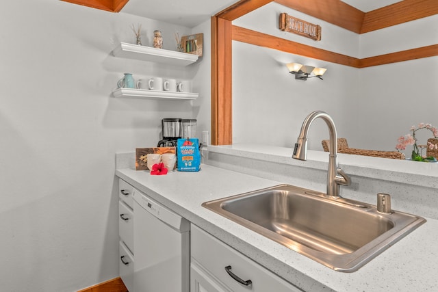 kitchen with white cabinetry, dishwasher, and sink