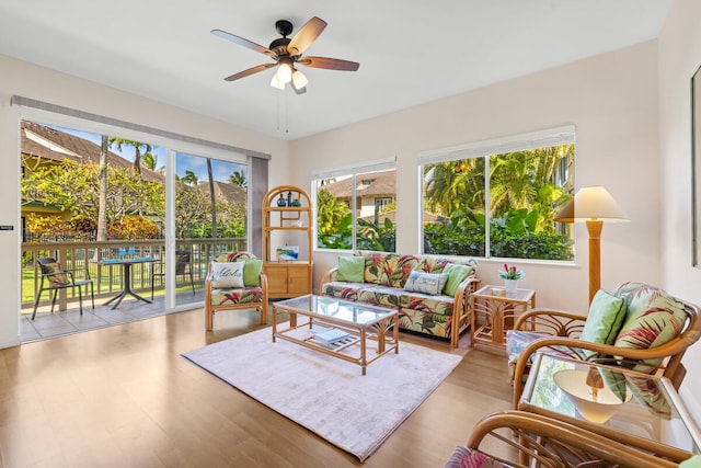 sunroom featuring ceiling fan