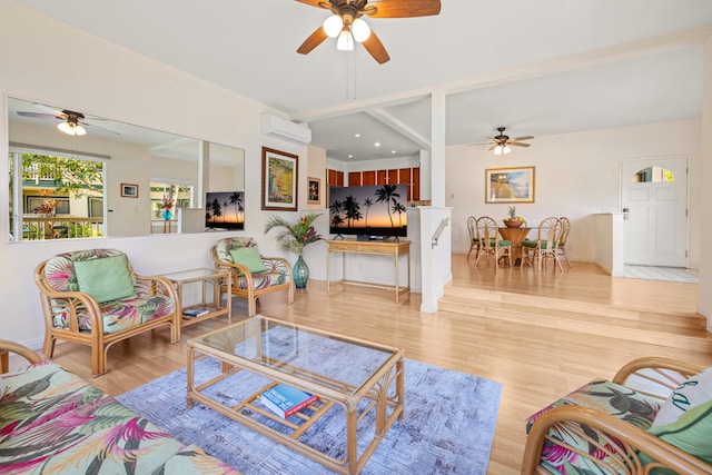 living room featuring light hardwood / wood-style floors and an AC wall unit