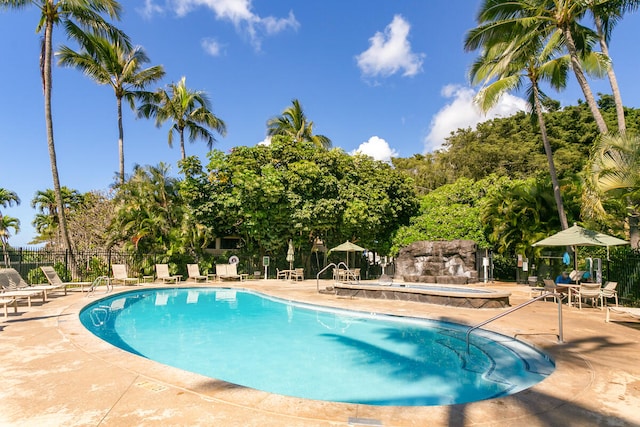 view of swimming pool with a patio