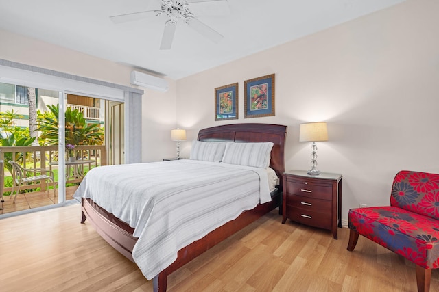 bedroom featuring ceiling fan, access to exterior, a wall unit AC, and light hardwood / wood-style flooring