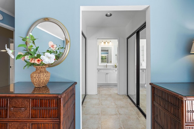 hallway with light tile patterned floors