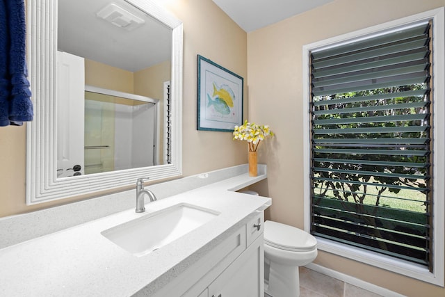 bathroom with vanity, an enclosed shower, tile patterned floors, and toilet