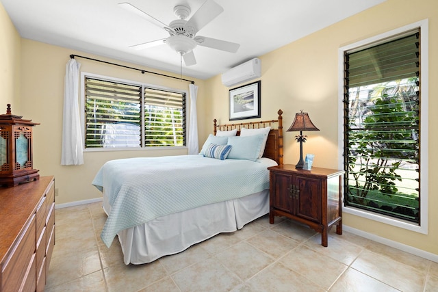 tiled bedroom with a wall unit AC and ceiling fan