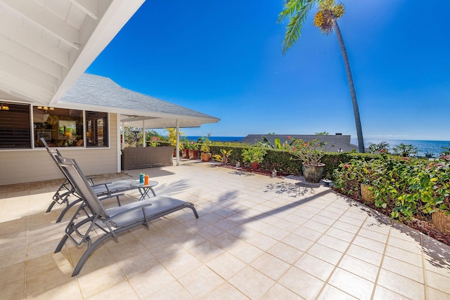 view of patio with a water view