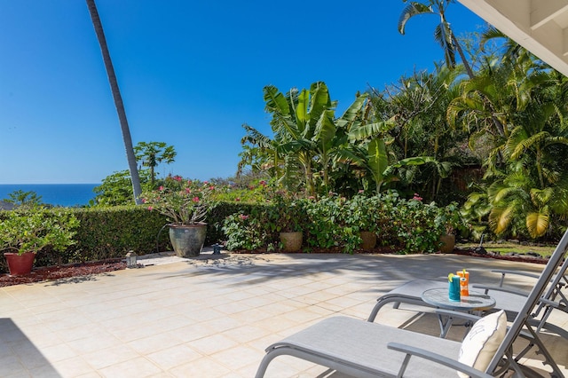 view of patio featuring a water view