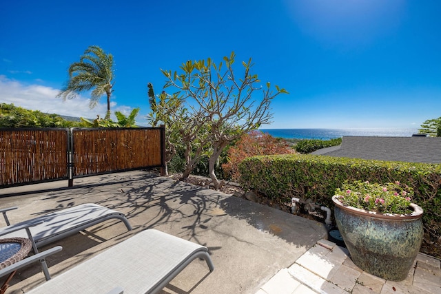 view of patio with a water view