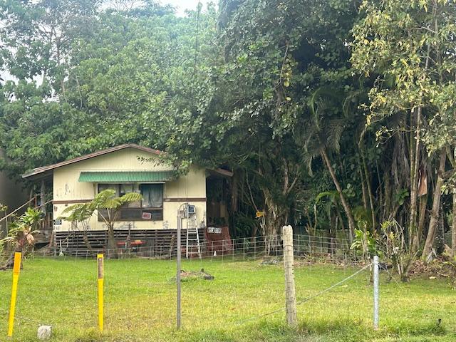 view of property exterior featuring a lawn