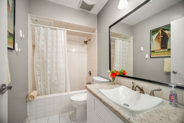 full bathroom with vanity, shower / tub combo, tile patterned floors, and toilet