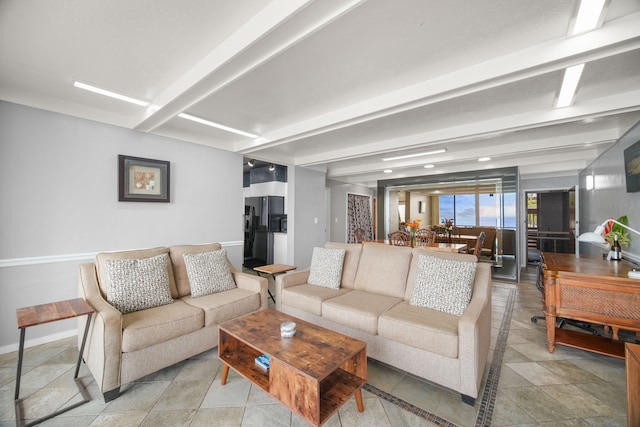 living room featuring beam ceiling