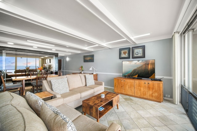 tiled living room with beam ceiling