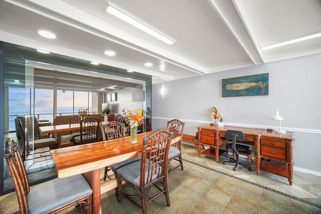 dining room featuring beam ceiling