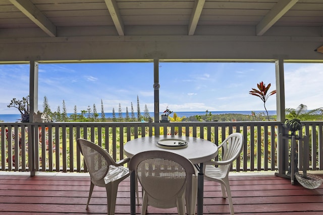 wooden deck featuring a water view