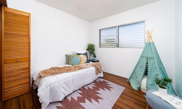 bedroom featuring dark hardwood / wood-style floors