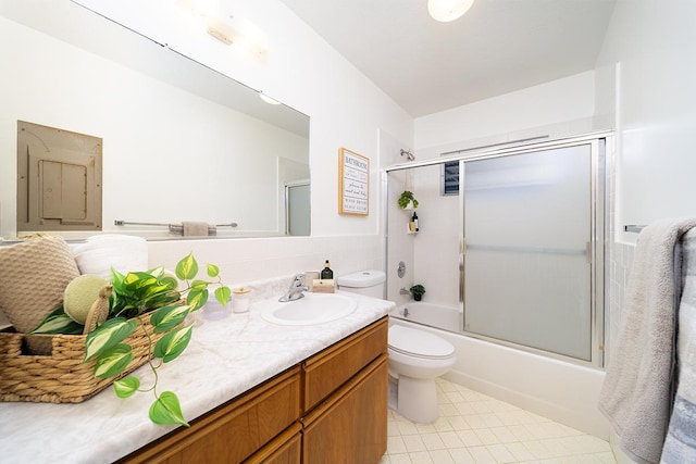 full bathroom with vanity, shower / bath combination with glass door, and toilet