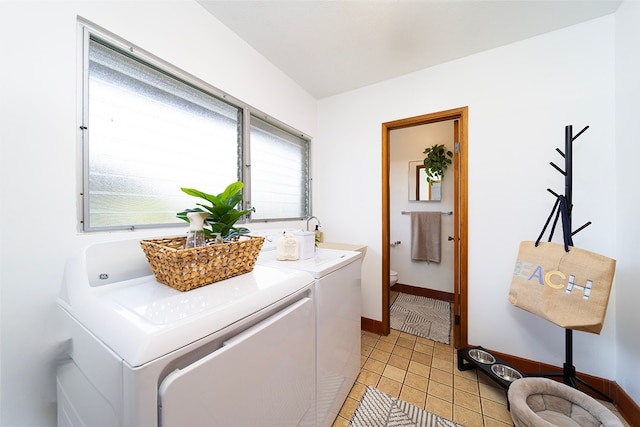 laundry room with light tile patterned floors and independent washer and dryer