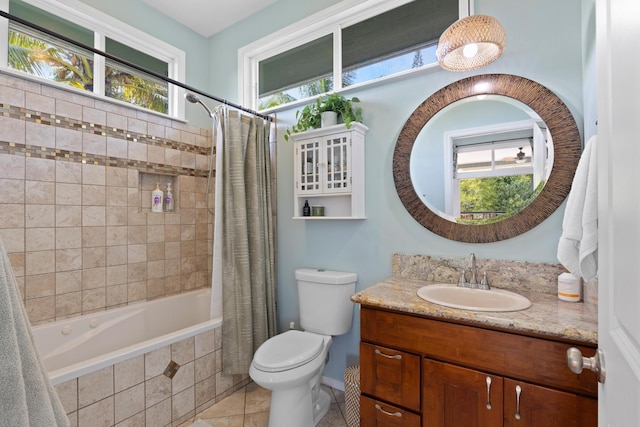 full bathroom with vanity, tile patterned floors, shower / bath combo with shower curtain, and toilet