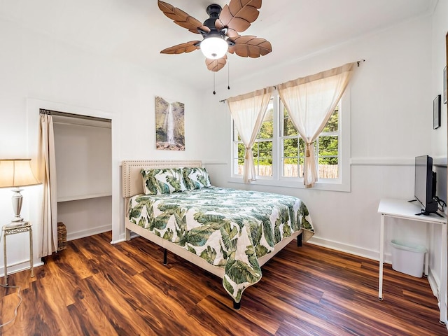 bedroom with dark wood-type flooring and ceiling fan