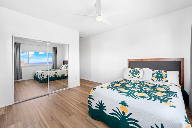 bedroom with hardwood / wood-style floors and ceiling fan