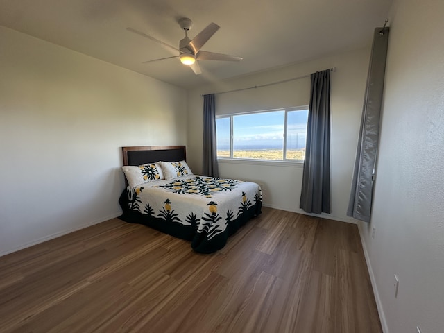 bedroom with wood-type flooring and ceiling fan