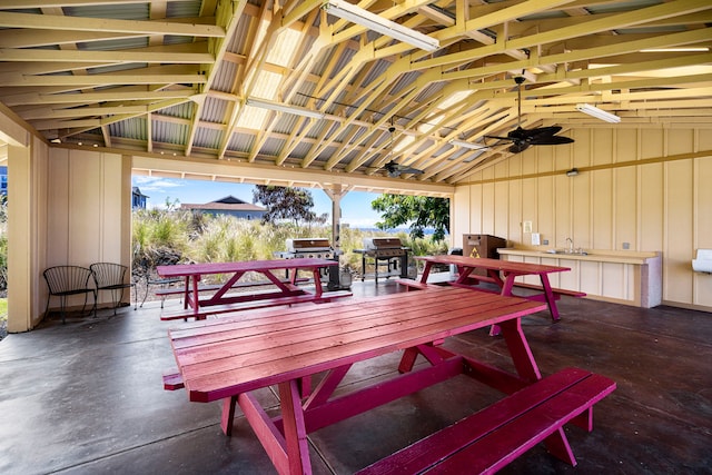 view of patio featuring area for grilling, sink, and ceiling fan