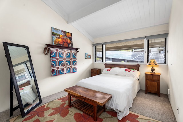 bedroom with vaulted ceiling with beams, wooden ceiling, and carpet