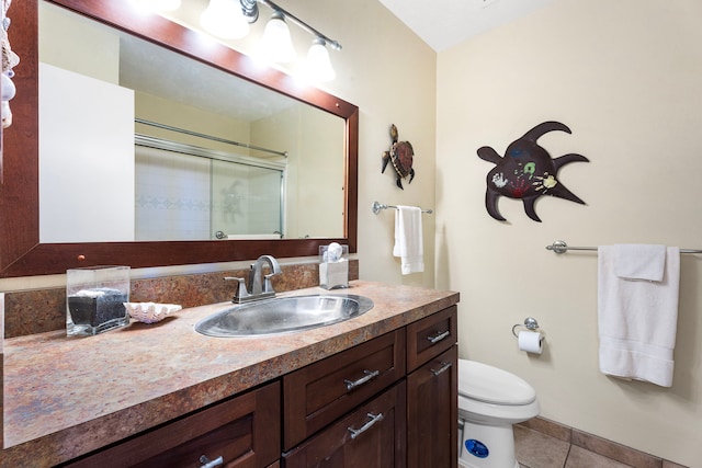 bathroom featuring walk in shower, tile patterned floors, toilet, and vanity