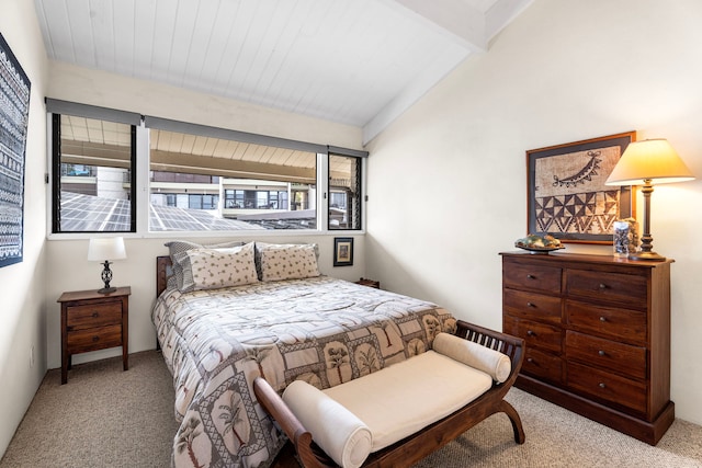 bedroom featuring light carpet and beam ceiling