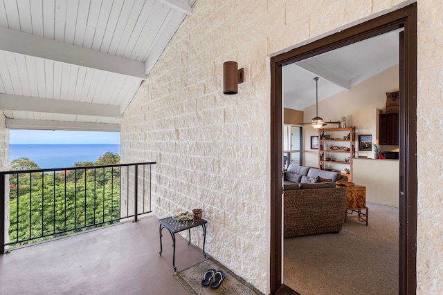 balcony featuring a water view