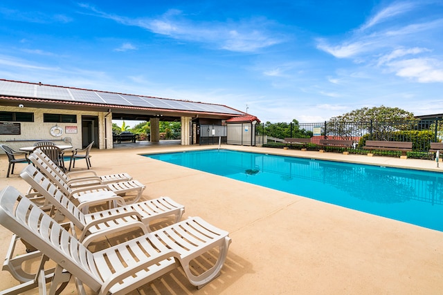 view of swimming pool with a patio