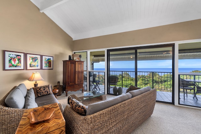 carpeted living room featuring beam ceiling and high vaulted ceiling