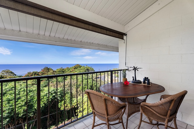 balcony featuring a water view