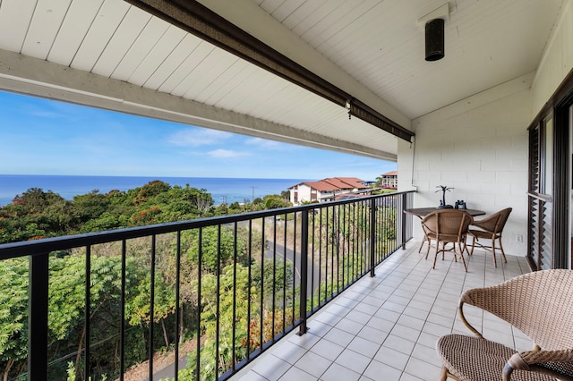 balcony featuring a water view