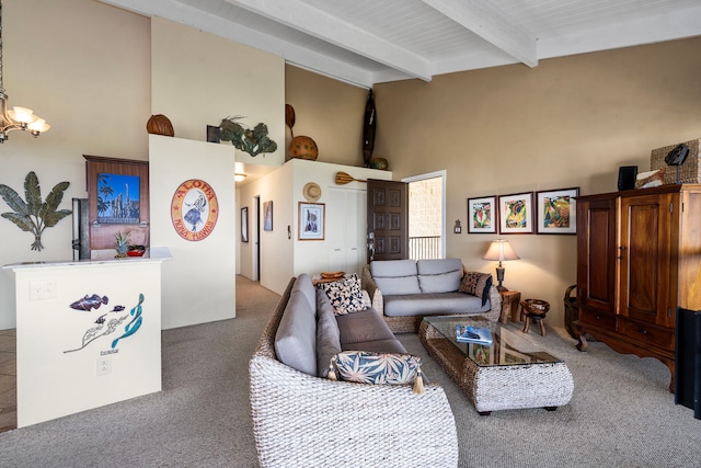 living room with beamed ceiling, a high ceiling, carpet floors, and an inviting chandelier