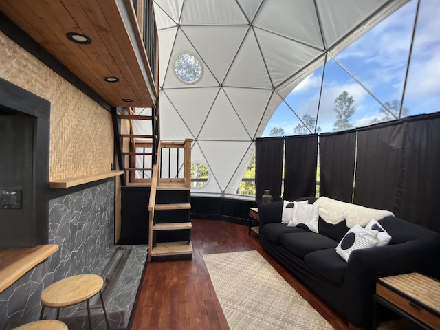 interior space with dark wood-type flooring and wooden ceiling