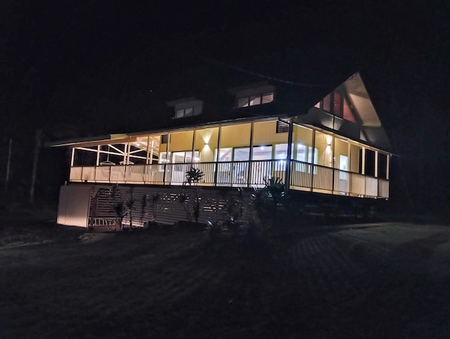 view of back of house at night