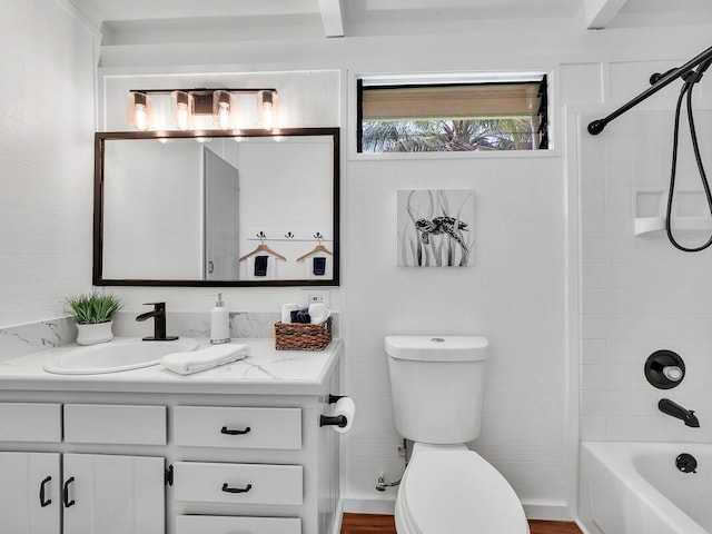 bathroom with washtub / shower combination, toilet, and vanity