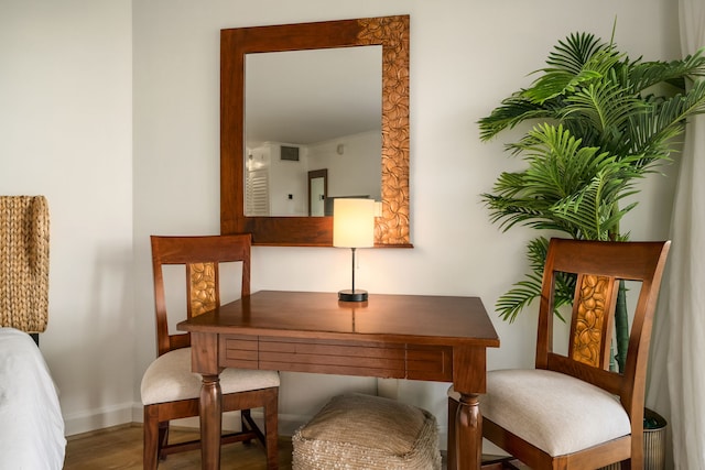 living area with hardwood / wood-style floors