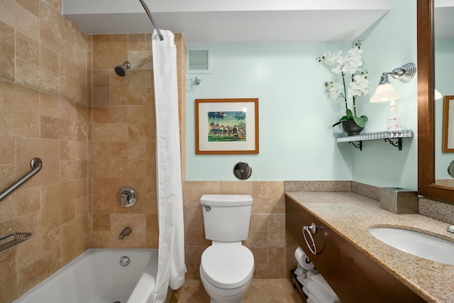 full bathroom with tile walls, vanity, toilet, and shower / bathtub combination with curtain