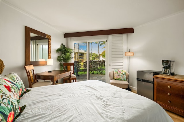 bedroom with crown molding, stainless steel fridge, and access to outside