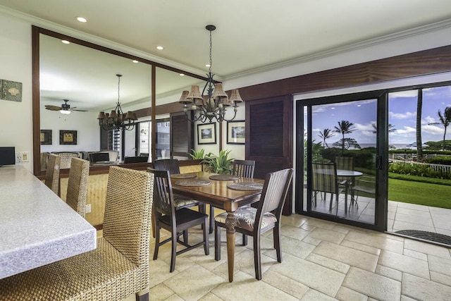 dining space with crown molding and a notable chandelier