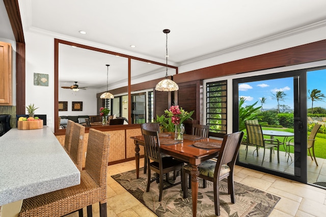 dining room featuring ceiling fan and ornamental molding