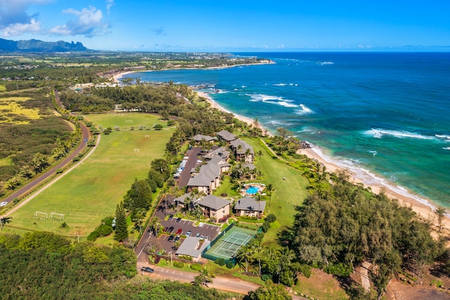 birds eye view of property featuring a beach view and a water view