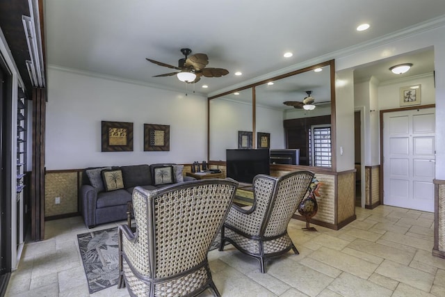 living room featuring ornamental molding and ceiling fan