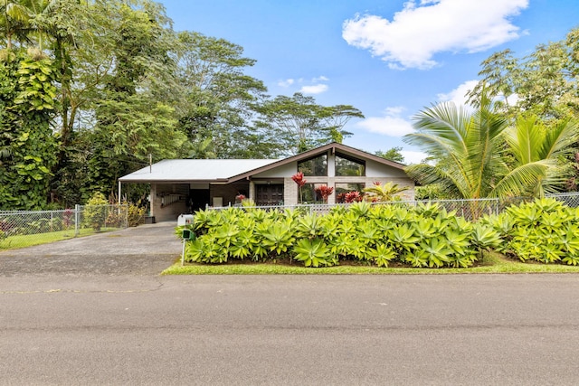 view of front of home with a carport