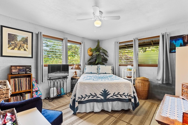 bedroom featuring ceiling fan and light hardwood / wood-style floors