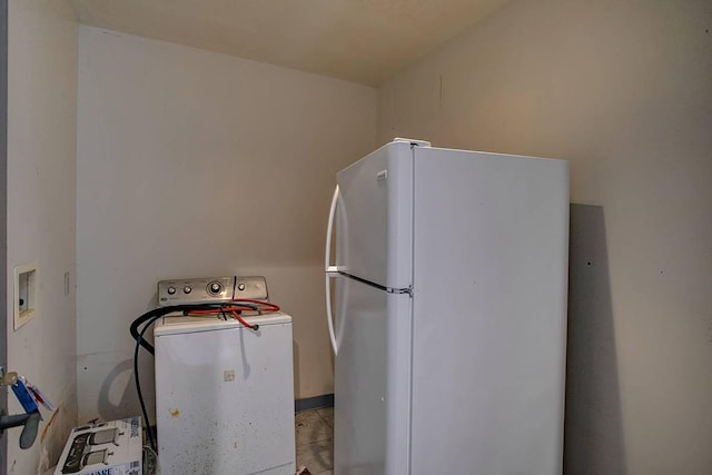 kitchen with white refrigerator and washer / clothes dryer