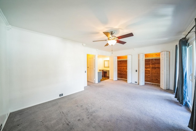 interior space with crown molding and ceiling fan